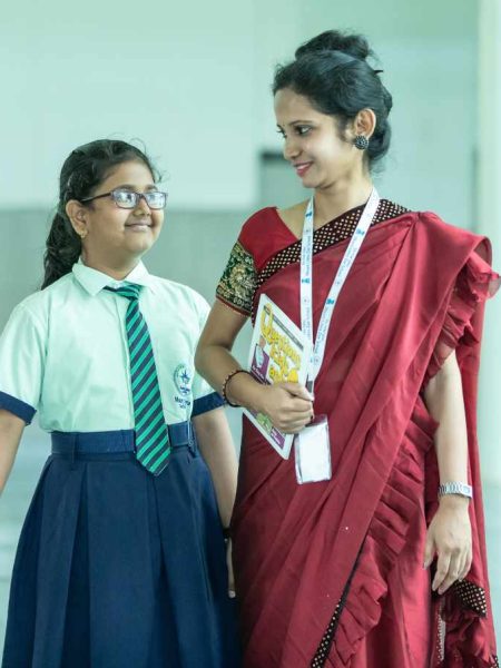 Indian Teacher Walking with Student